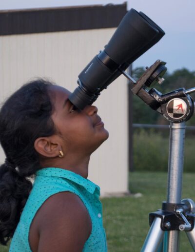 Girl looking through binoculars