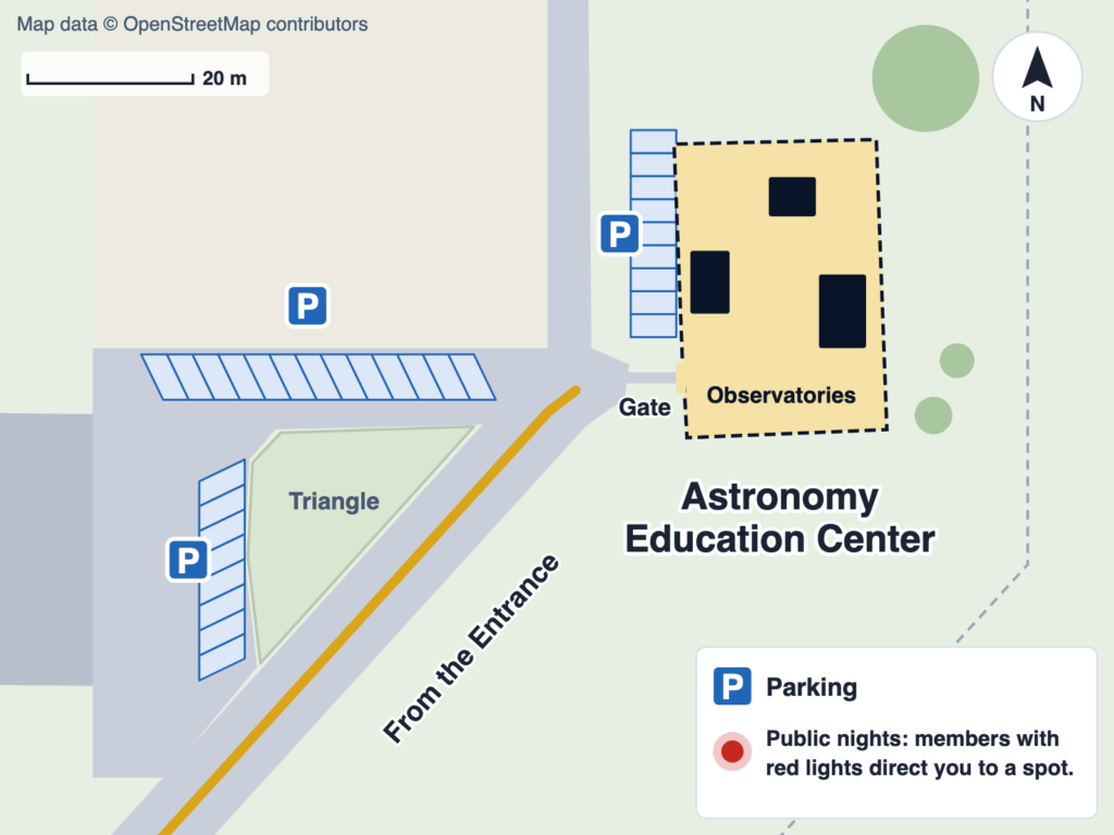 Close-up map of parking at the Astronomy Education Center: angled parking along the road and the paved area beside the grass triangle west of the AEC, and a row along the west side of the AEC's fence.